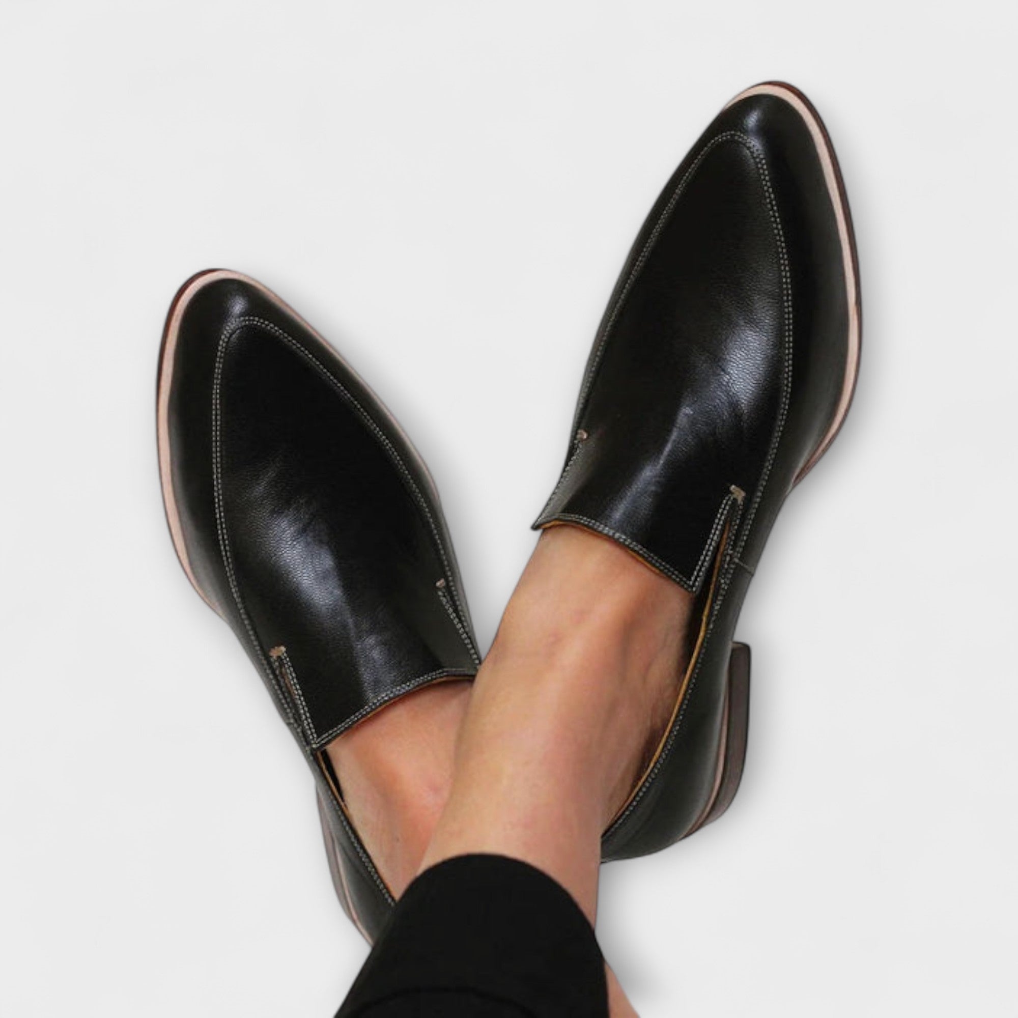 Orthopedic loafers for women in classic black leather, designed for all-day comfort and support, ideal for casual and professional wear. 0